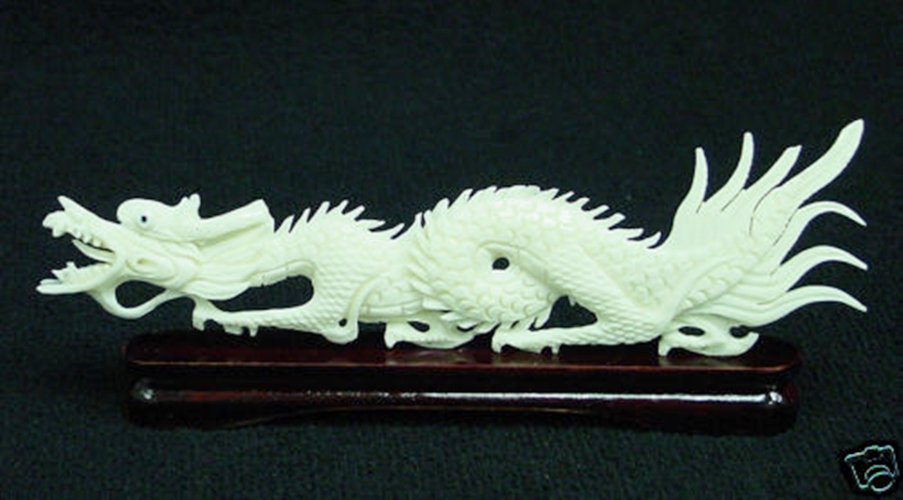 SOLID BONE DRAGON: Solid Bone Dragon - Long: 5", Wide: 1", High: 2" - This Dragon Is Made From Solid Bones. All Natural And All Hand Carved From Solid Bone. It Is Not Bone Powder, Resin Or Mouded. Very Detailed Carving.