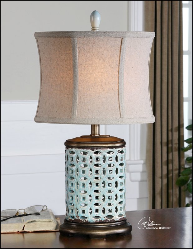 ROSIGNANO BLUE BUFFET LAMP: ROSIGNANO BLUE BUFFET LAMP - PIERCED CERAMIC FINISHED IN A CRACKLED AGED BLUE GLAZE WITH RUST DISTRESSING AND BURNISHED SILVER CHAMPAGNE DETAILS. - PIERCED CERAMIC FINISHED IN A CRACKLED AGED BLUE GLA