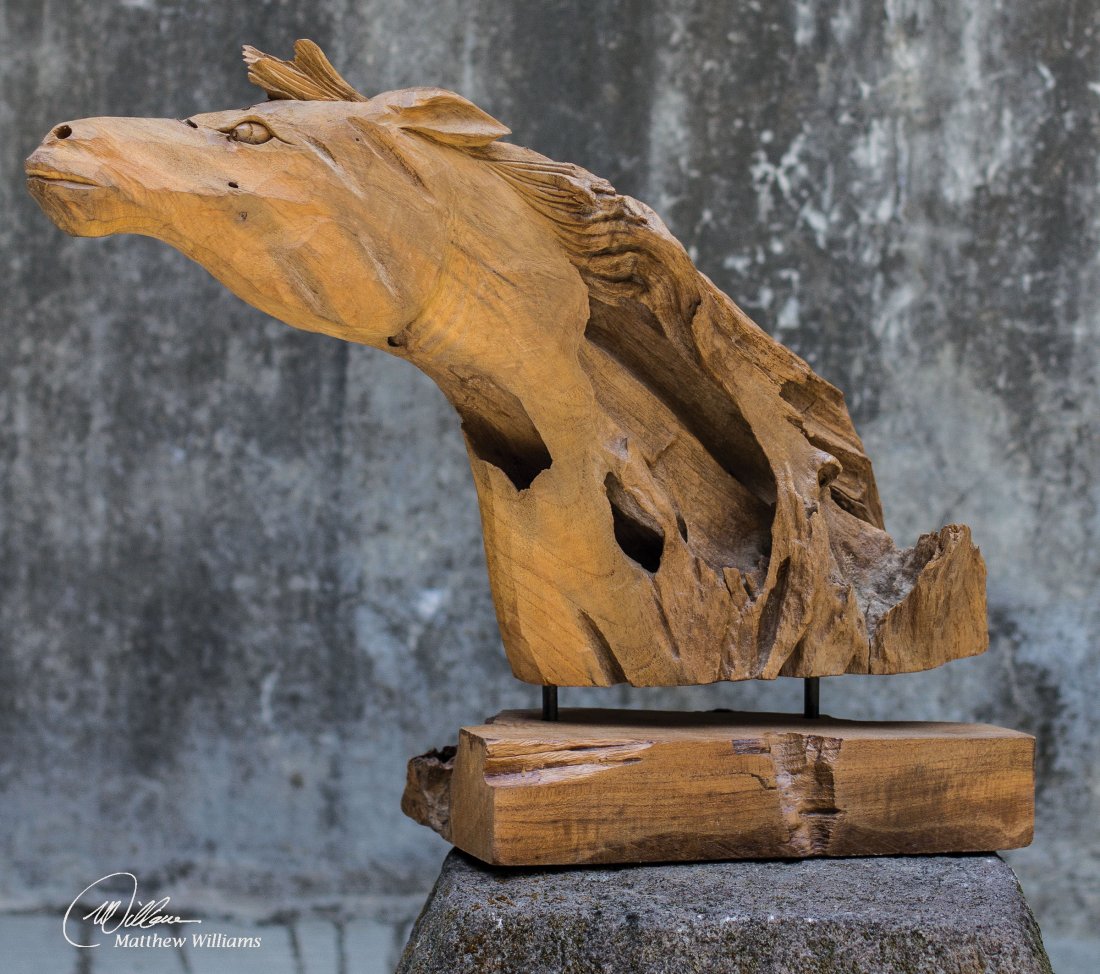 TEAK HORSE SCULPTURE: TEAK HORSE SCULPTURE - NATURAL TEAK WOOD. - MADE OF NATURAL TEAK WOOD. EACH PIECE IS HANDCRAFTED MAKING IT UNIQUE. SIZES WILL VARY. CRACKS AND VARIATIONS IN THE GRAIN ARE NORMAL. MATERIAL: TEAK WOOD O