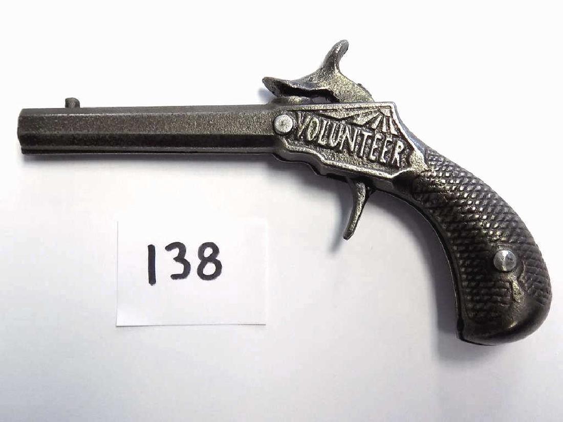 STEVENS VOLUNTEER CAST IRON CAP PISTOL PAT 1873 Stevens: Stevens c1873 Volunteer Cast Iron Cap gun pistol with Octagonal barrel. patented April 22, 1873. Also known as the target model. Working order. Nice condition, nice patina.