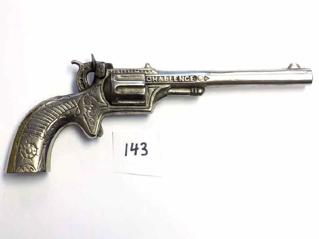 STEVENS CHALLENGE CAST IRON CAP GUN PISTOL Stevens 1890: Stevens 1890 Challenge Nickel plated Cast Iron Cowboy Cap gun pistol with spur trigger. Long 9" barrel. Ornate cast scrollwork. Working order. Nice condition. Rated 3 Stars by Logan & Best.