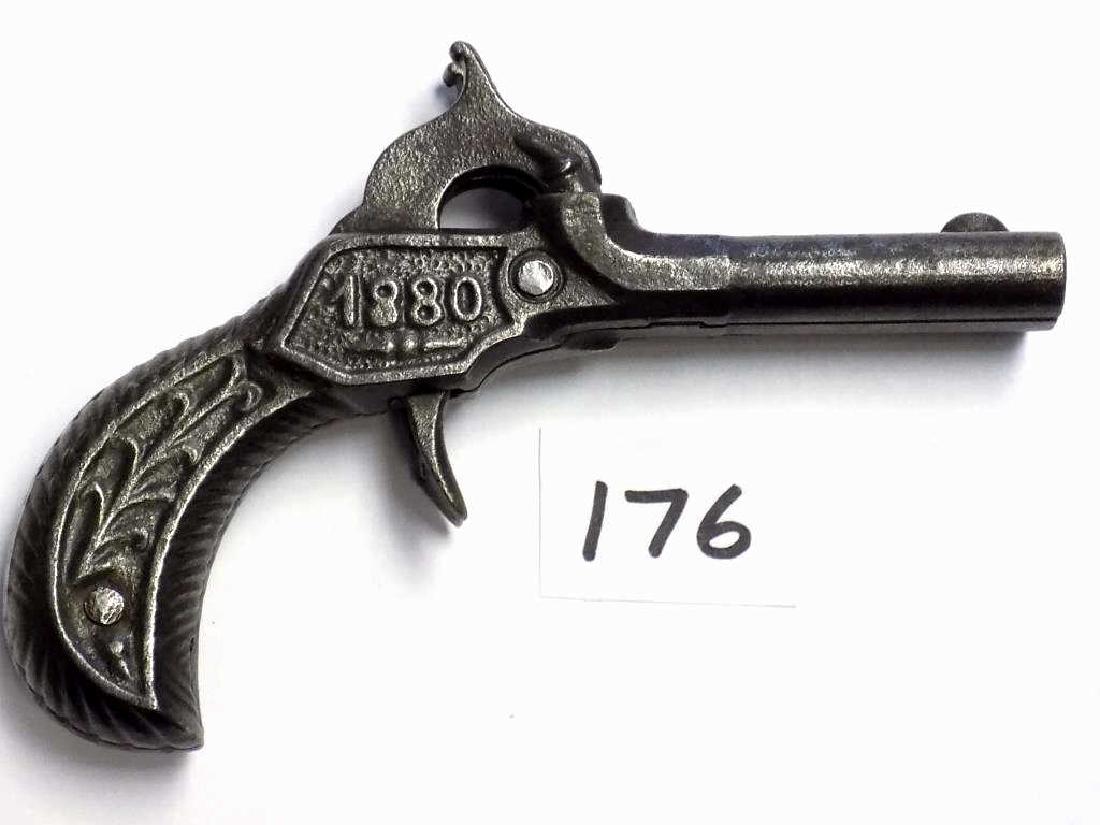 STEVENS 1880 DOUBLE BARREL CAST IRON CAP PISTOL Rare: Rare Stevens 1880 Cast Iron Double Barrel cap gun pistol. Scrolled casting with date on each side. Working order. Very nice condition. Rated 3 Stars by Logan & Best. Only 16 Double Barrel Cast Iron ca