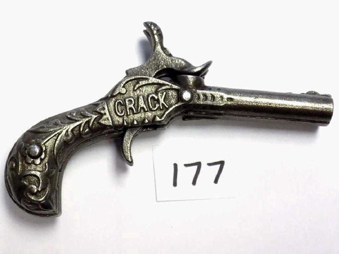 IVES CRACK DOUBLE BARREL CAST IRON CAP GUN PISTOL Rare: Rare Ives Crack Double Barrel Cast Iron cap pistol with Dual Hammers and Dual Spur Triggers. One of only 16 double barrel pistols made. Ornate cast scrollwork. Working Order. Very Nice Condition. Rate