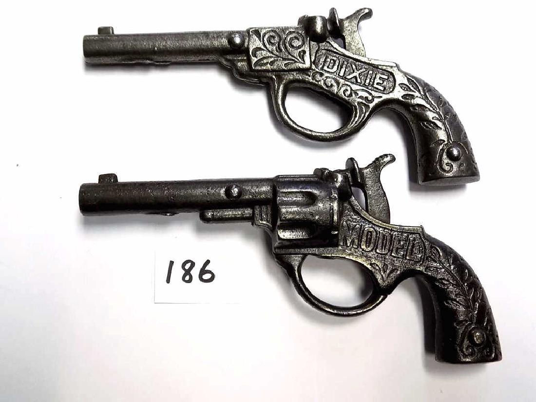 STEVENS DIXIE & MODEL CAST IRON CAP GUN PISTOLS 2 Early: 2 Early Stevens Dixie Cast Iron cap gun pistol Pat June 17 1897. Along with a Model Cast Iron cap gun pistol Pat June 17 1890. Both Ornately cast with Scrolls and Foilage, In Working order, and with n