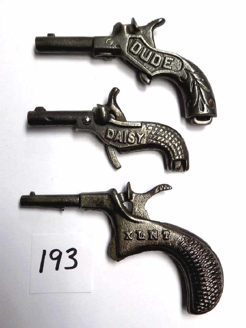 MINIATURE DUDE DAISY & XLNT CAST IRON CAP GUNS Rare: Rare Miniature Group of Cast Iron cap gun pistols including: Dude Pat Mar 22 1887, Daisy Pat Mar 22 1887, XLNT No date. All in Working order. Very Nice condition.