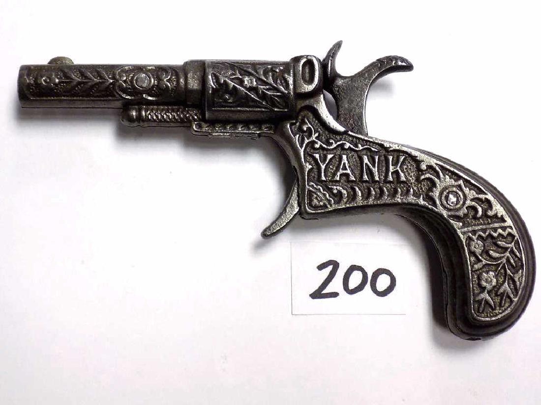 RARE 1880 LOCKWOOD YANK CAST IRON CAP GUN PISTOL 1880: 1880 Lockwood Manufacturing Co. So. Norwalk CT Cast Iron YANK cap gun pistol. Ornate Floral scrollwork. In Working order, very nice condition / patina. Rated 4 Stars "Cast Iron Toy Guns & Shooters" bo