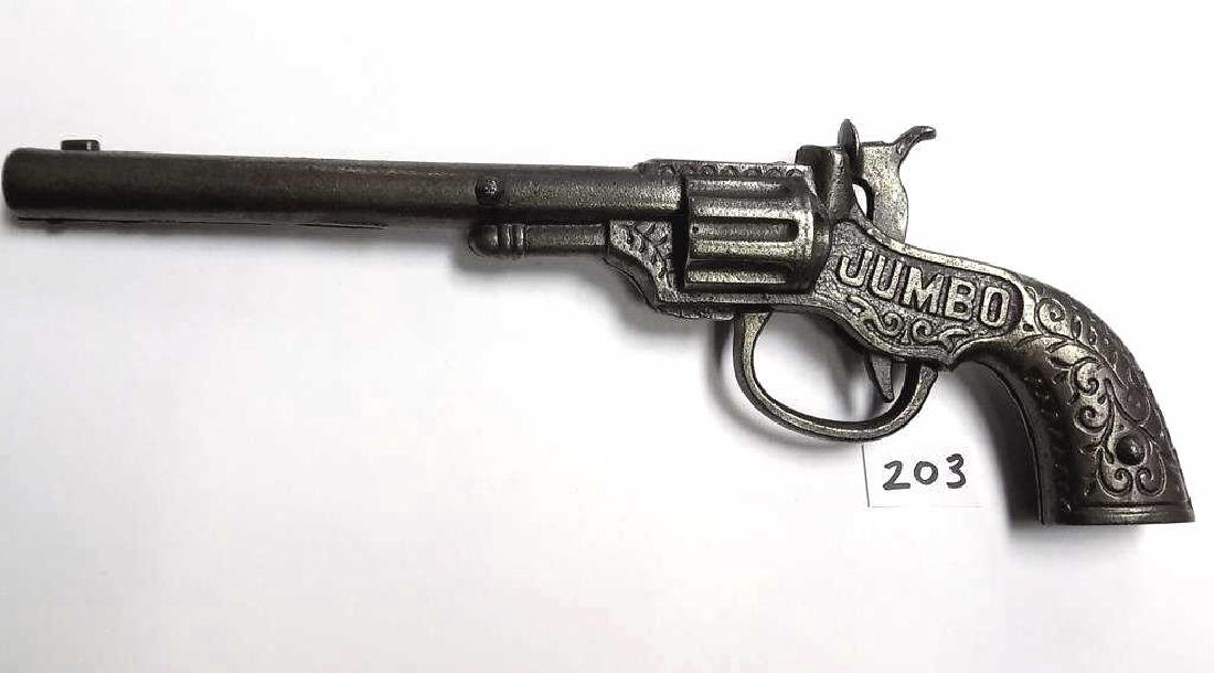 JUMBO COWBOY CAST IRON CAP LONG GUN PISTOL Antique: Antique JUMBO Cast Iron Western Cowboy cap gun pistol with Long barrel. Pat June 17, 1890. Ornate scrollwork. Working order, Very nice condition / patina. Length 9 1/2"
