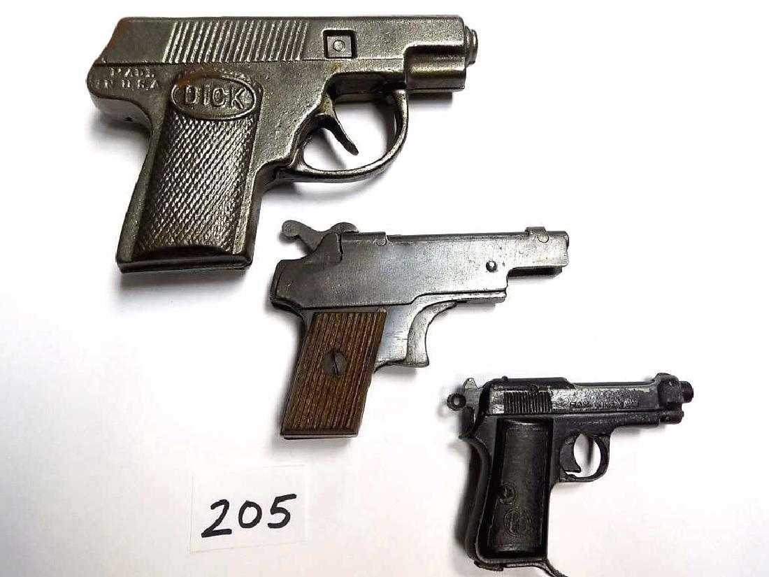 HUBLEY DICK KOLIBRI & TIP0 BARETTA CAP GUNS Hubley 1930: Hubley 1930 DICK (TRACY) Cast Iron Baretta cap gun pistol 4" Length, along with a Miniature Kolibri Austria Model 4 Baretta blank gun with Mahogany grips. Along with a Tipo Beretta 934 Marked M.A.M. U