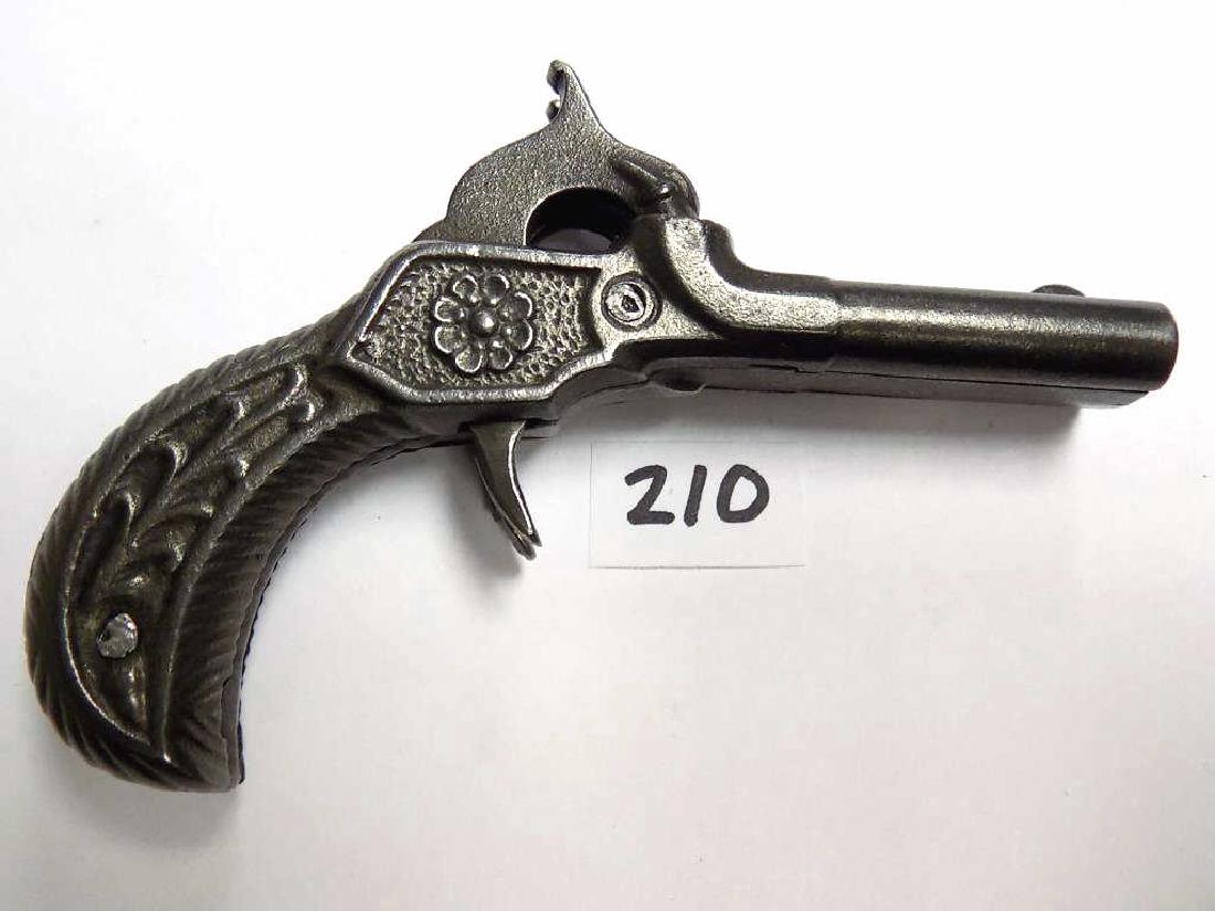 RARE 1800'S STEVENS DOUBLE BARREL CAP GUN PISTOL Rare: Rare 1800's Stevens Double Barrel Cast Iron Derringer type cap gun pistol. Ornate casting with rosettes and scrolled vines. Unmarked. Only 16 double barrel model cap guns were produced. Working order