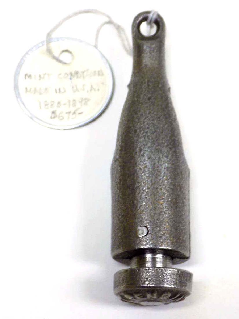 RARE COKE BOTTLE CAST IRON TOY CAP BOMB Rare Coke: Rare Coke Bottle Cast Iron Toy Cap Bomb Circa 1880's. Marked Patent Pending. Fires .22 Caliber Blank cartridges. Working order, Nice condition / Patina. Height 3 1/2".