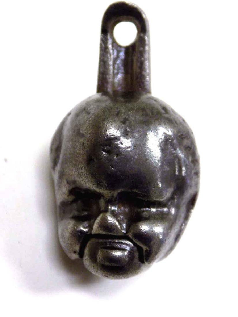 RARE IVES 1890 BABY'S HEAD CAST IRON CAP BOMB Rare Ives: Rare Ives Company1890 Cast Iron Baby's Head Cast Iron Toy Cap Bomb. Working Order, Nice condition, Nice Patina. Shown in book Cast Iron Toy Guns & Collectibles p.240. Length 1 3/4". Valued $350-$400.