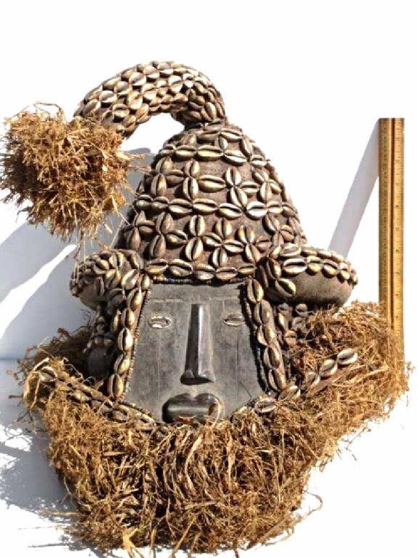 AFRICAN CENTRAL CONGO CARVED HEAD DRESS Antique African: Antique African Central Congo ceremonial head dress. Carved wood with beads, conch shells . H 17" x L 12".