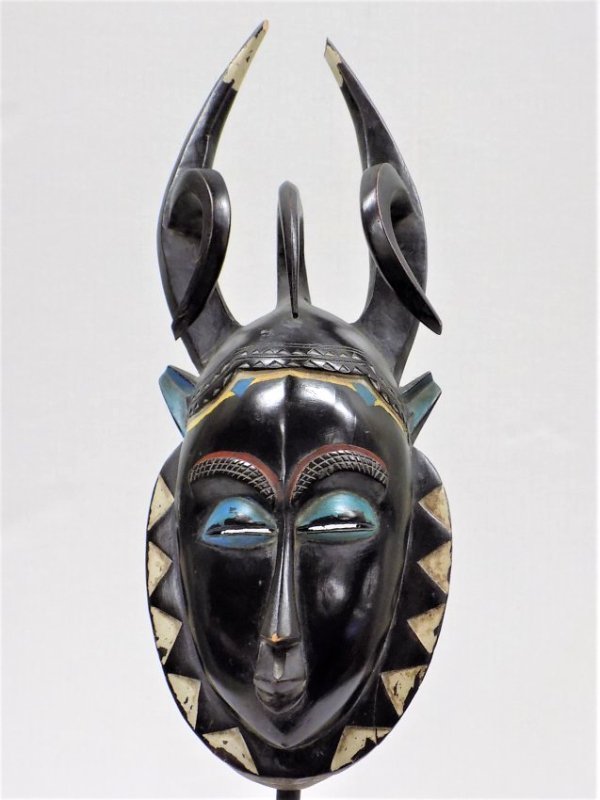 AFRICAN YAKA DAN CEREMONIAL MASK: Antique African Yaka Dan Tribe Carved Ceremonial Mask. Old repaint. Height 20". 25 1/2" with Custom Steel display stand.