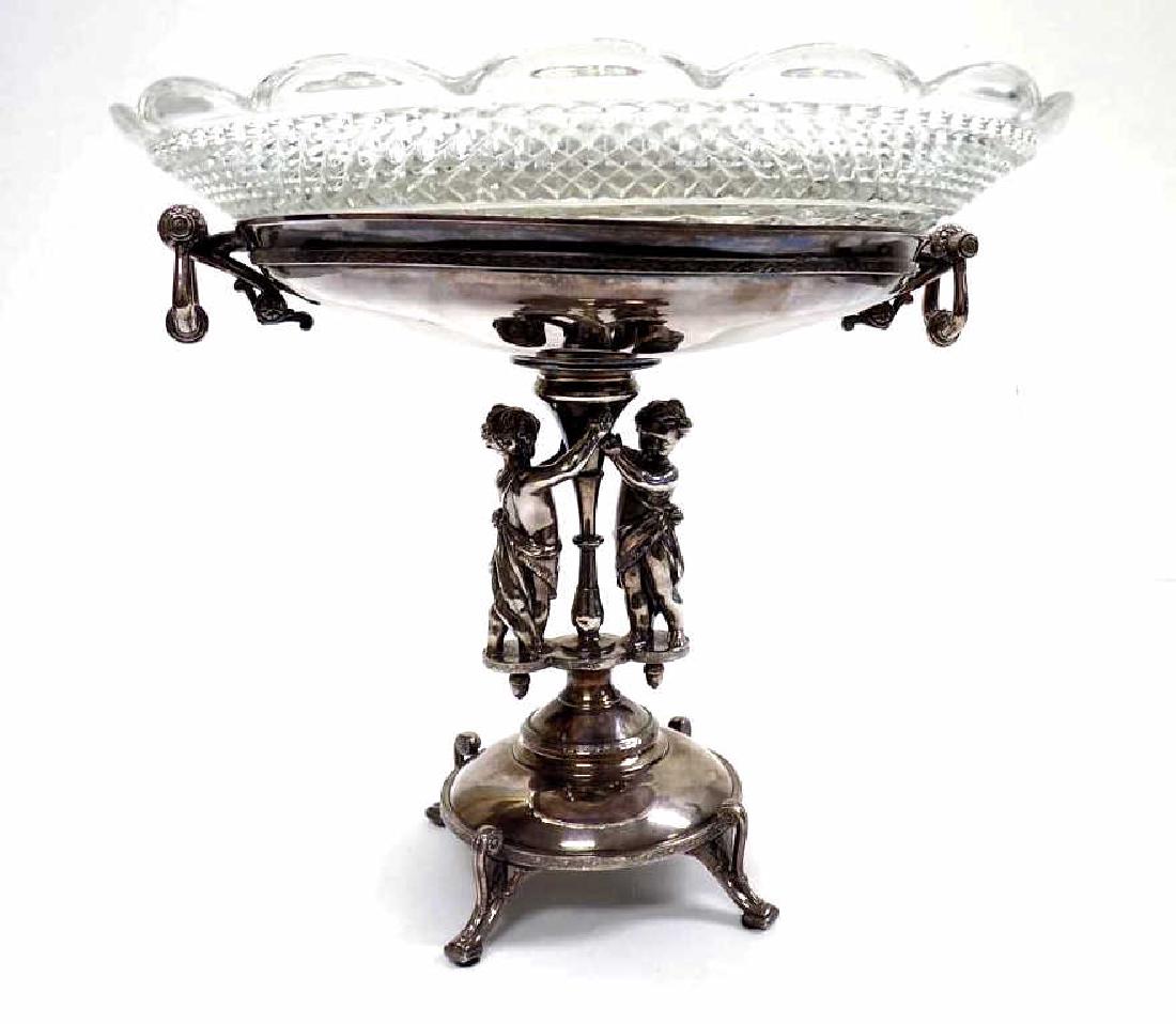 VICTORIAN REED & BARTON FIGURAL SILVERPLATE COMP: Superb Victorian Reed & Barton Company Figural Silverplate Compote with Original diamond pattern glass bowl. Pair of semi nude putti holding up a turned column. Ornate scrollwork throughout, hanging m
