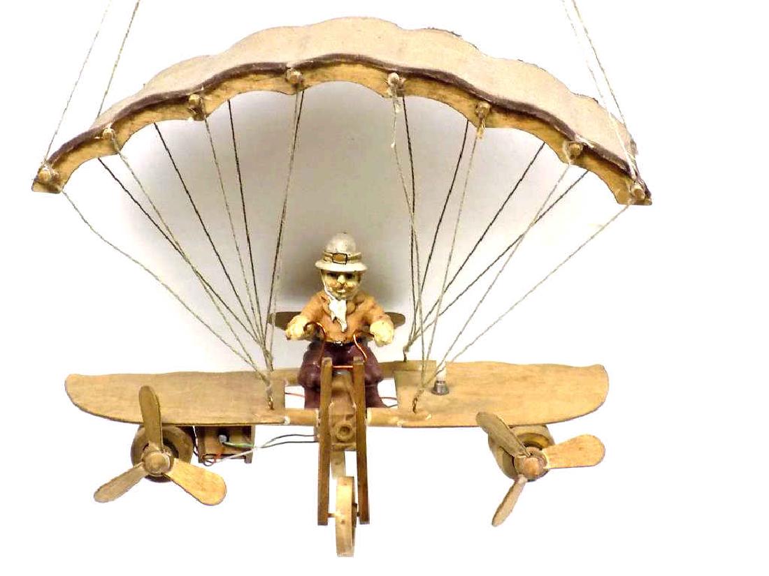 FOLK ART AIRPLANE FLYER WOODEN TOY: American Folk art hand carved & painted wooden Airplane with pilot. Motorized propellers. 9" x 10 1/2".