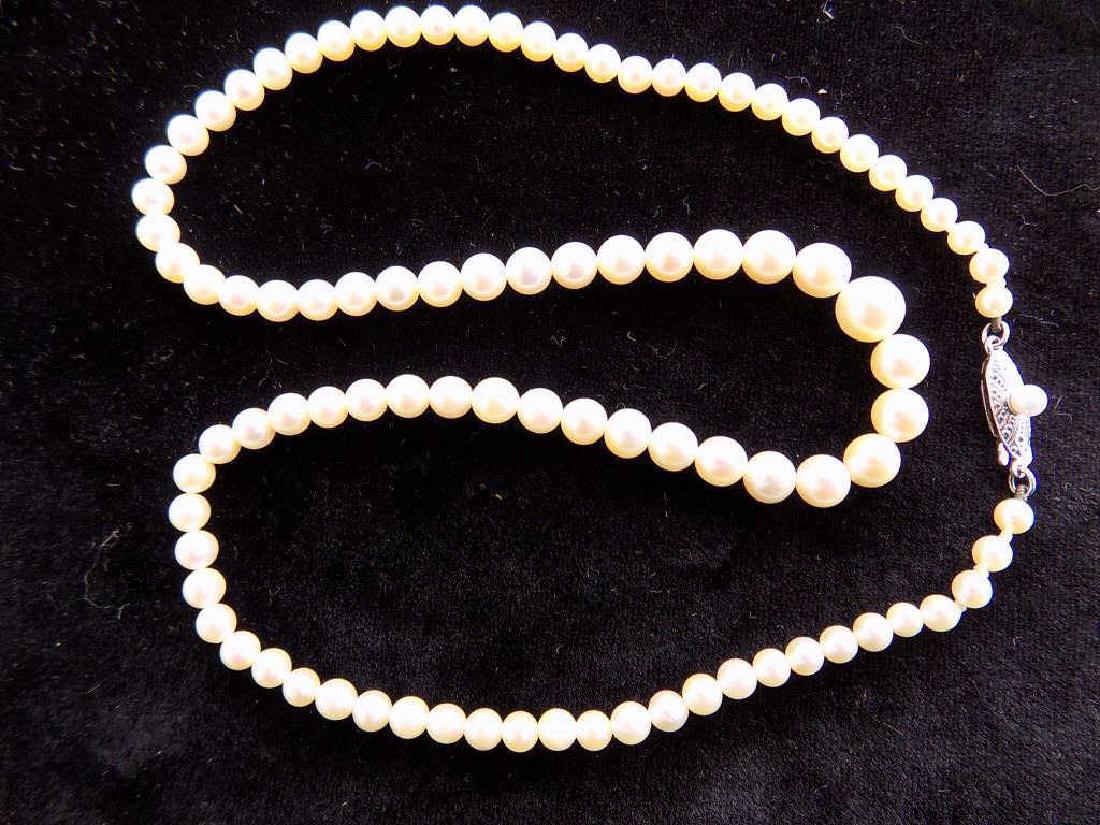 MIKIMOTO 10K GOLD CLASP GRADUATED PEARL NECKLACE: Vintage Mikimoto Graduated Pearl Necklace with Reticulated 10K White Gold Locking Clasp. Signed