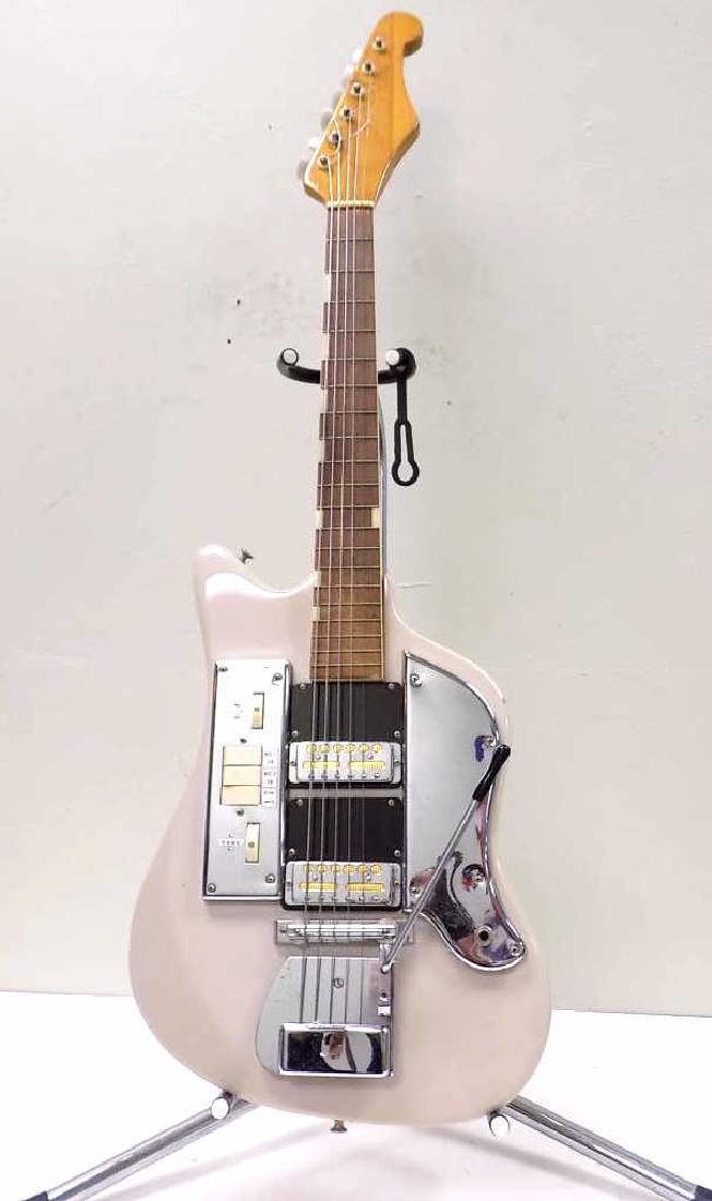 VINTAGE ZIMGAR JAPANESE ELECTRIC GUITAR: Vintage 1960's Zimgar Japanese Electric Guitar. Chrome Hardware, Dual Humbucking pickups, 3 Control Buttons, Volume Control and Tone Dials. Tremelo Whammy Bar. Rosewood Fretboard with Bone inlay. Whit