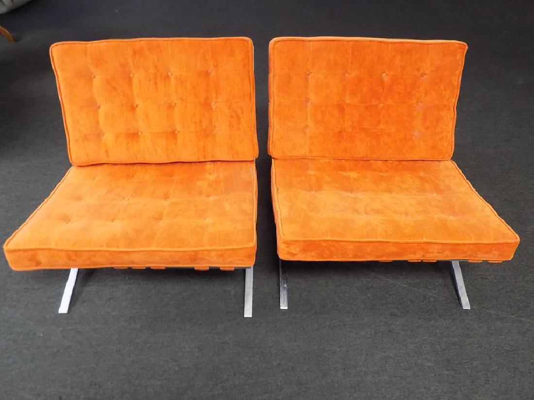 MIDCENTURY MODERN BARCELONA CHAIRS: Pair Midcentury Modern Barcelona Chairs. After the Design by Mies Van Der Rohe for Knoll International 1970's. Chrome and Tufted Orange Padded Cloth Cushions. Approximate Dimensions Height 30.50" x Si