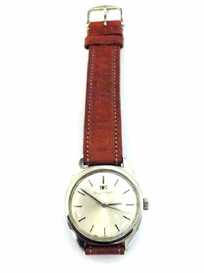 INTERNATIONAL WATCH CO. IWC MEN'S WRISTWATCH: Vintage IWC INTERNATIONAL WATCH CO. Men's Wristwatch. Silver Chrome Steel Case 35mm and Face with Blue Accent Markers. Swiss movement. Brown Leather strap IWC marked Buckle. Crown Logo. Working order.
