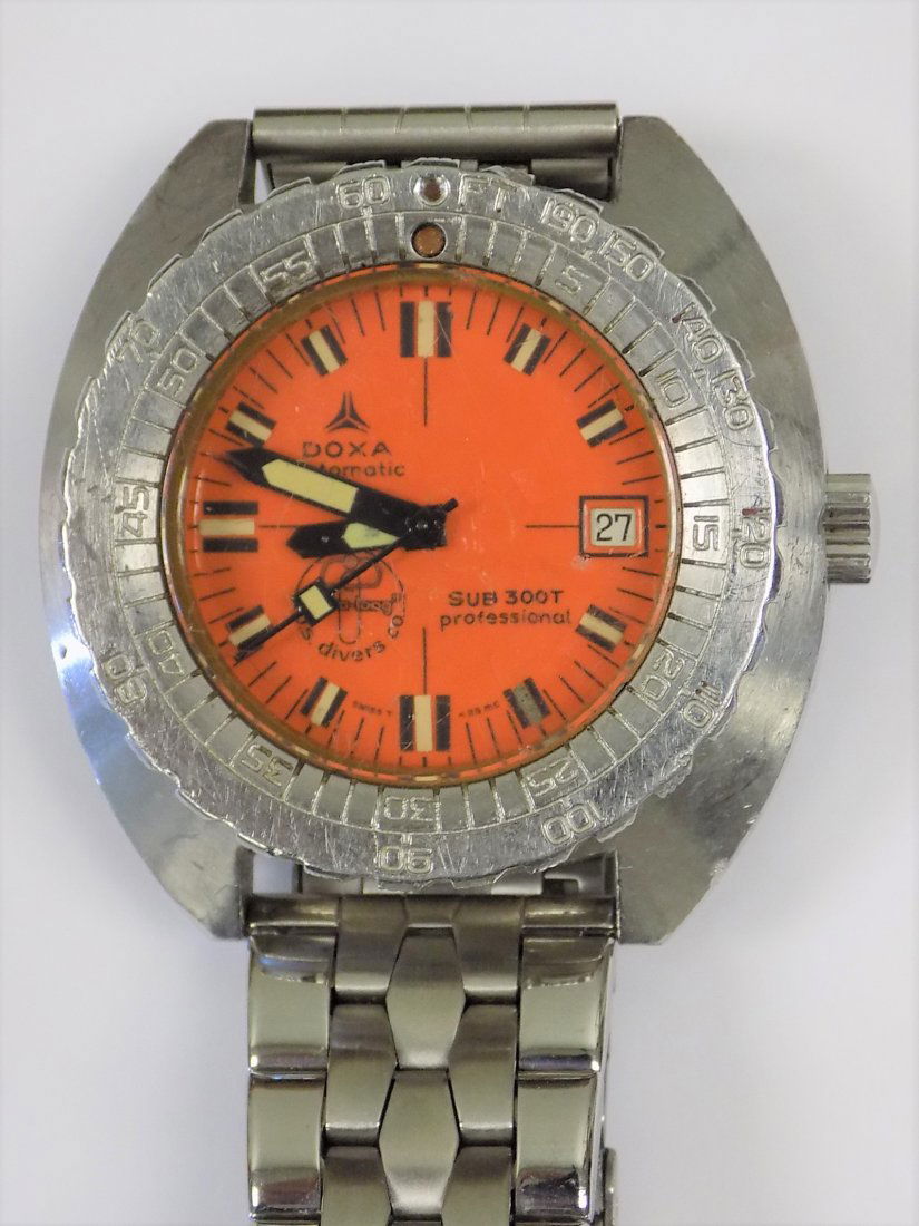 DOXA ORANGE SUB 300T AQUA LUNG DIVERS WRISTWATCH: Rare 1960's 70's DOXA Automatic Orange Sub 300T Professional Aqua Lung U.S. Divers Co Men's Divers Wristwatch. Big Silver Chrome Water Resistant 42mm Steel Case with Synchron embossed back. Glow in th