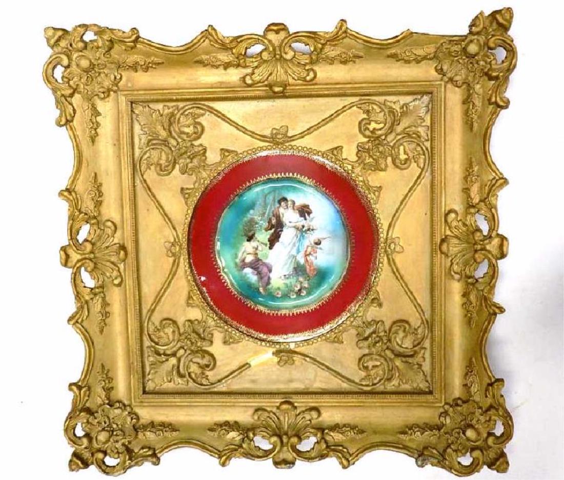 VICTORIAN FRAMED RENAISSANCE SCENIC GILDED PLATE: 19th Century Ornate Victorian Framed German Bavarian Porcelain Plate. Renaissance Scene with Figures and Cupid. Gold Decorated Borders. Stamped Germany, Numbered, C.T. Eagle Mark. 19.50" x 20", Plate 