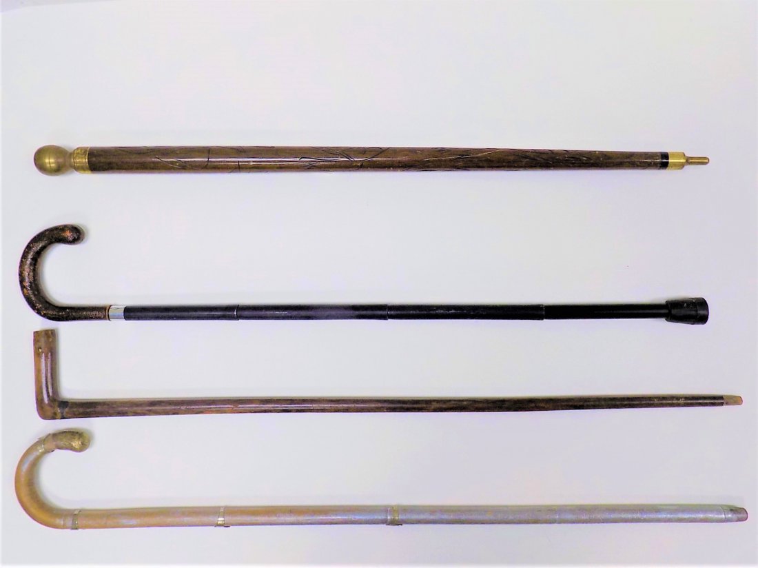 GROUP OF 4 UNUSUAL WALKING STICKS / CANES: Group of 4 Unusual Walking Sticks / Canes. Including Silvered Oak with Metal Mounts, Elm wood with Silver Mount, Portable Black Steel, Brass Top Oak Stick with Hidden Pool Cue.