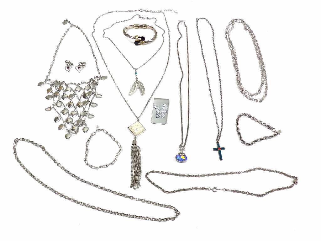 VINTAGE SILVER COSTUME JEWELRY LOT 13 PIECES: Vintage Lot of Silver Costume Jewelry. Including Eagle money clip, Gold & Black enameled Bracelet, Necklaces: Enameled Cross, Inset stone, Rainbow Rhinestone, Indian Feathers, Monet Ropetwist, Hearts