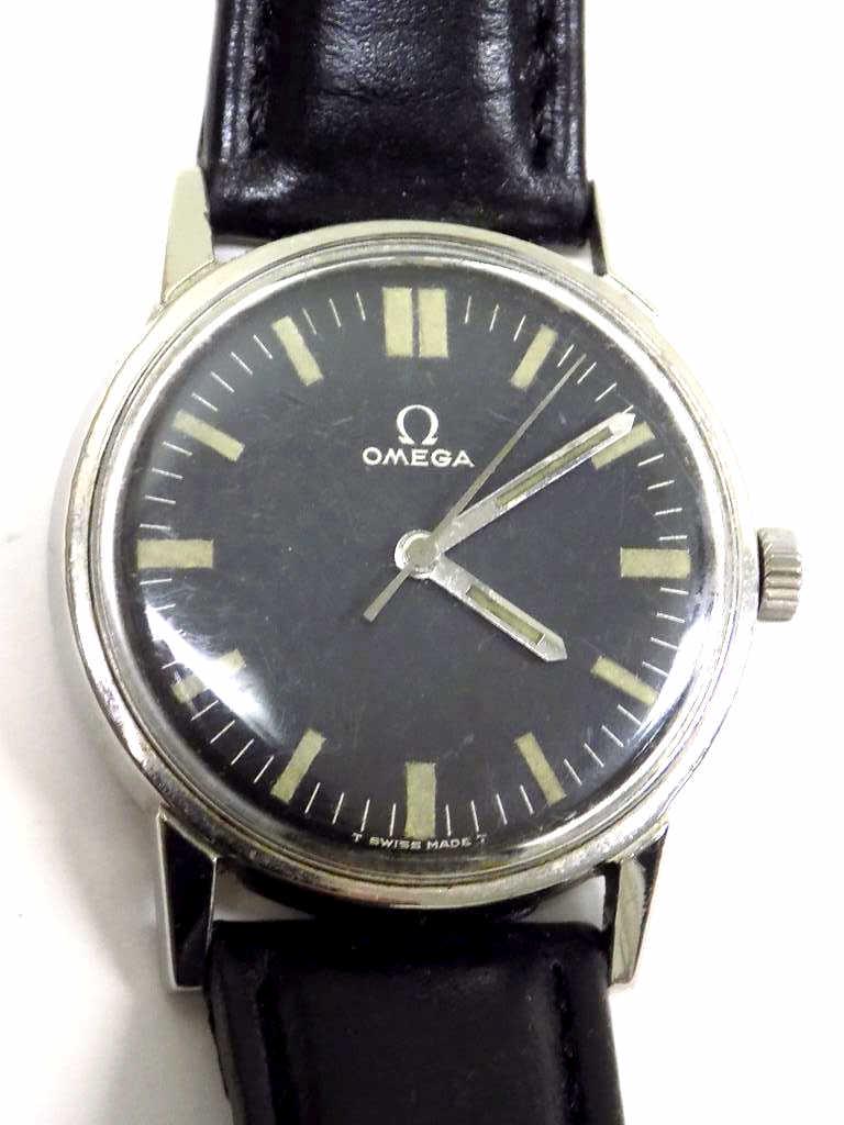 OMEGA CAL 601 17 JEWELS BLACK DIAL WRISTWATCH: 1960'S Omega Cal 601 17 Jewels Swiss Movement Gentleman's Wristwatch. Chrome Black Dial with Glow in the Dark Markers. Steel 32mm Case. Black Calf Leather Strap with Goldplated Buckle. Working order,