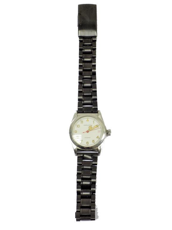 HAMILTON AUTOMATIC 7040A MEN'S WRISTWATCH: Vintage Hamilton Automatic 7040A Men's Wristwatch. White Dial with Glow in the Dark Indicators. Chrome Steel 42mm Waterproof Case. Numbered Back. Working order. Replaced Black Steel Bracelet Band.