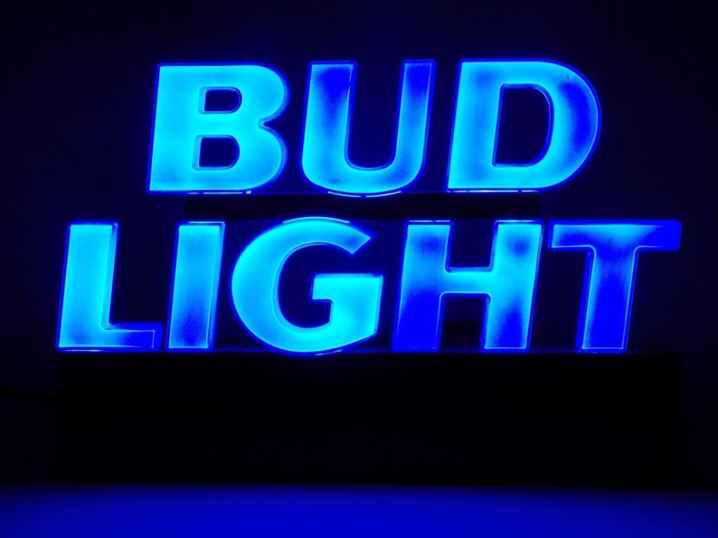 BUD LIGHT BEER NEON LIGHT ADVERTISING SIGN: Blue Bud Light Beer neon light Advertising sign with transformer. H 12 1/2" x L 18". Working order. Minor loss upper edge of U.