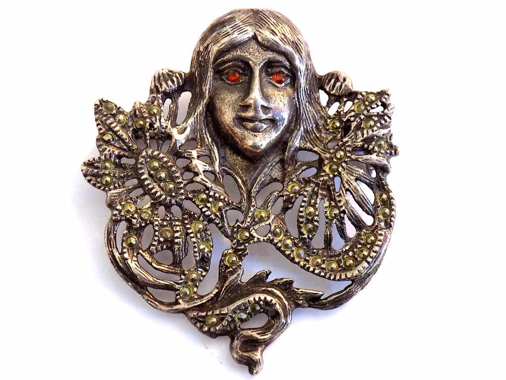 ART NOUVEAU STERLING SILVER MAIDEN BROOCH: Vintage Art Nouveau Sterling Silver Marcasite Maiden Brooch. Inset Ruby Eyes.
