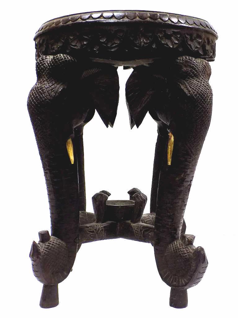 ANTIQUE INDIA CARVED ROSEWOOD ELEPHANT STAND: Antique India Carved Rosewood Elephant Stand. Detailed with Floral Vines and Rosettes. Inset Bone. 13" x 17"
