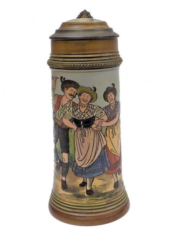 GERMAN CELEBRATION POTTERY BEER STEIN: Antique German Pottery Beer Stein with Fancy Pewter Thumb piece. Decorated with Celebrating Figures. Base Numbered 1661. Mettlach Style. Height 9.5"