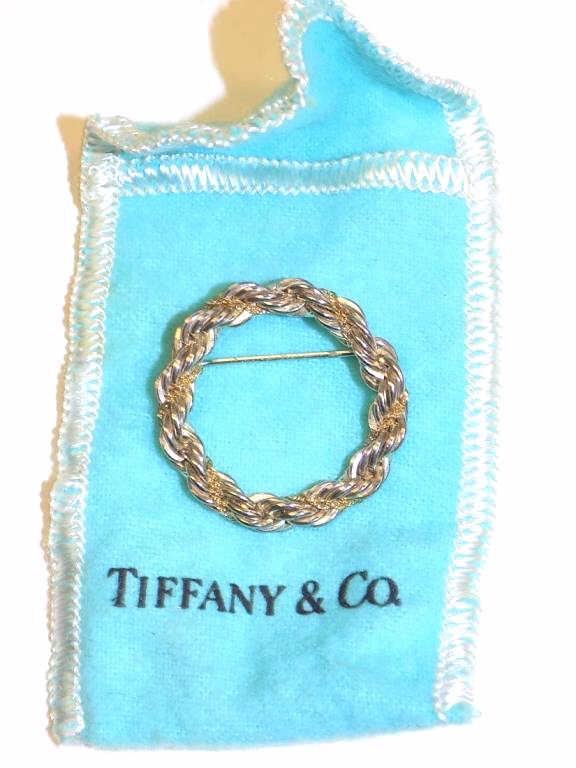 TIFFANY 18K YELLOW GOLD & STERLING WREATH BROOCH: Tiffany & Co. Sterling Silver Braided Wreath Brooch Pin with entwined 18K Yellow Gold Link Chain. Signed & Numbered with Original Pouch.