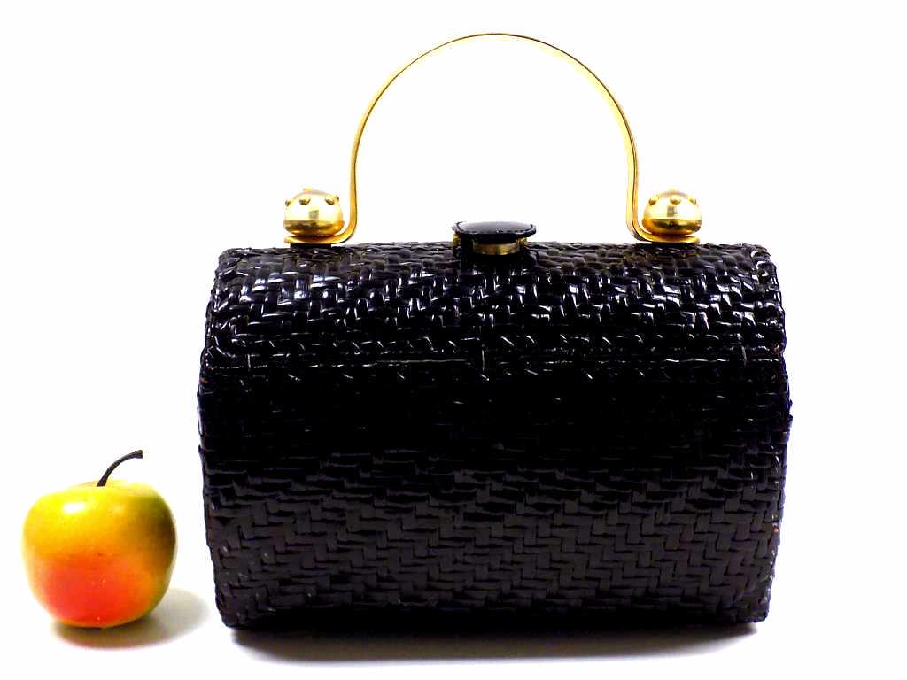 VINTAGE RODO DESIGNER HAND BAG: Vintage Rodo Italian Designer Hand Bag. Gold Plated Handle with Lucite Mounts. Black Basketweave Design, Gold Interior Pocket. Magnetic Snap Closure. 7" x 9"