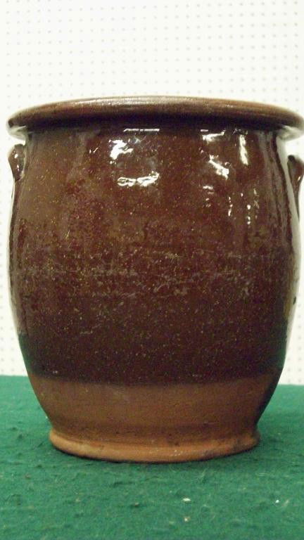 REDWARE DOUBLE HANDLED CROCK: 19th C. Redware double handled crock. Lipped rims. Yellow interior glaze. H 7 1/2"" x D 7"". Lower 2"" intentionally unglazed.