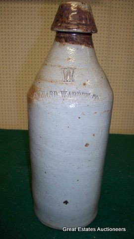 RICHARD WARREN CO. STONEWARE BOTTLE: Richard Warren Company salt glaze stoneware bottle. 19th Century. H 11" x D 3 1/2". Brown decorated.