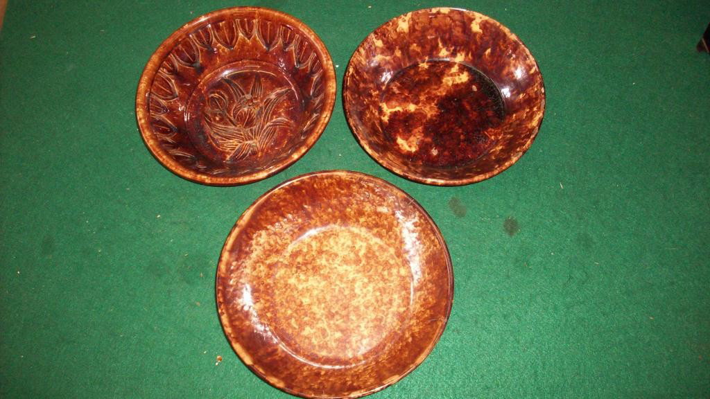 3 19TH CENTURY ROCKINGHAM MIXING BOWLS: 3 19th Century Rockingham brown & yellow spatterware mixing bowls. Tulips & petals design in 1 (inner glaze wear) . Remaining 2 have chips & hairlines. H 3"" x D 9"".