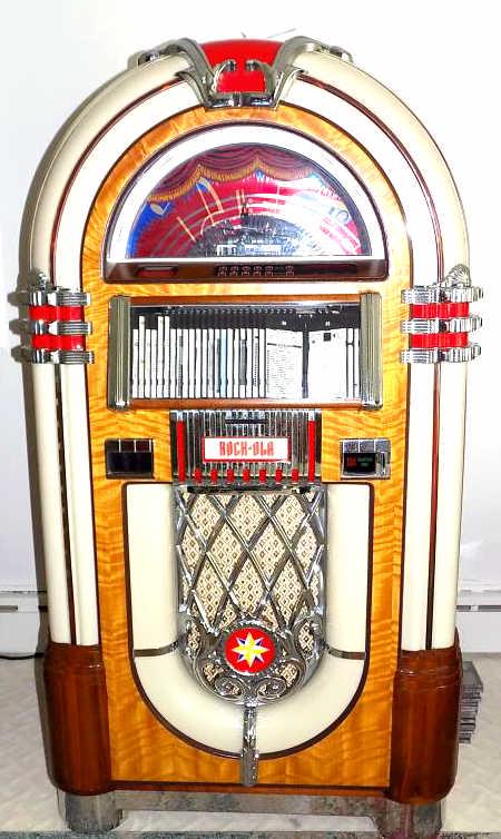 DECO STYLE ROCKOLA MUSIC JUKEBOX CD PLAYER: Art Deco Style Rockola Music Jukebox CD Player. Excellent Condition with Instruction Manual. Item Must Be Picked Up From a Port Jervis, NY Estate By Appointment.