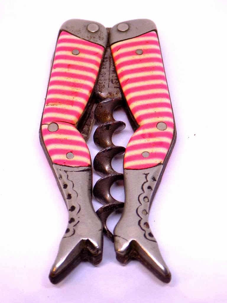 RARE VICTORIAN POCKET CORKSCREW LADIES / LADY LEGS: Rare Victorian Stahl Kunsstoff Ladies / Lady Legs Folding Pocket Corkscrew. Made in Germany. Height 2 1/2 inches Pink and White Zebra Stockings. Very Good condition.