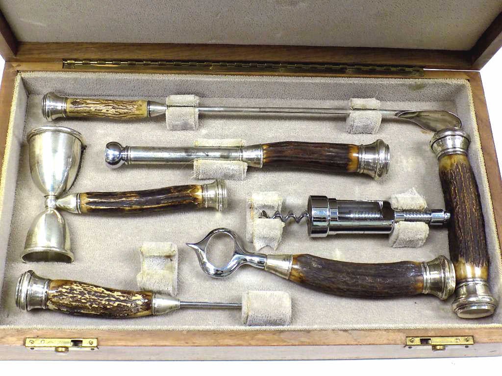 JOHN HASSELBRING STERLING & BONE BARWARE SET: Fabulous John Hasselbring Barware Set in Antique Oak Wood Case. Finest Quality Stag Bone Handles with Sterling Silver Mounts. Complete Set of 6 Individual Pieces Including Large Corkscrew, Bottle Open