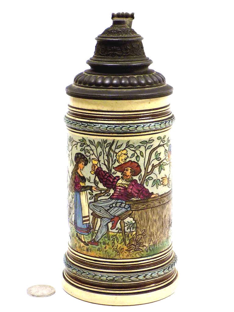 ANTIQUE GERMAN DRINKER INCISED BEER STEIN: Antique German Pottery Beer Stein. Colorful Incised Decoration of a Drinking Man with Figures. Barley Decorated Borders. Fancy Pewter Lid. 1/2 Liter. Height 9" Numbered 973