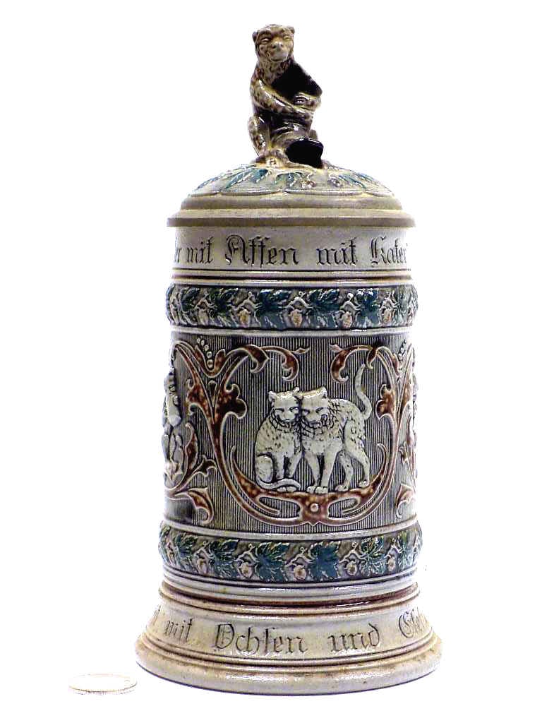 RARE FOLK LORE ANIMALS GERMAN BEER STEIN: Rare German Folk Lore Pottery Beer Stein. Raised Relief Decoration with Surrounding Cats, Bear Finial and Handle. Engraved 1825 Inscription on Pewter Border. 1/2 Liter. Height 9" Numbered 940.