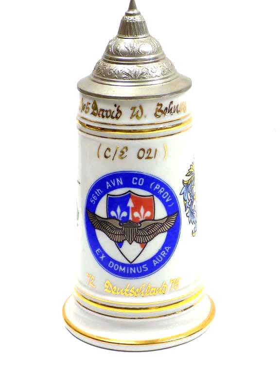 AMERICAN COLD WAR MILITARY REGIMENTAL BEER STEIN: American Cold War Military Regimental Beer Stein. Made in Germany Circa 1950's. Issued to SP5 David W. Behney. From the 56th Avn Co. Air Base Ex Dominus Aura. Issued 1972-1975 Deutschland. Gold Gilt D