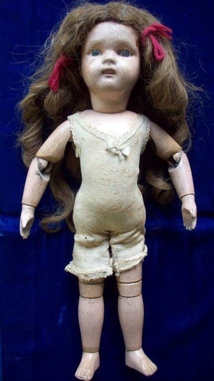 RARE SCHOENHUT JOINTED WOOD GIRL DOLL: Schoenhut All wood with spring jointed body with Schoenhut decal on back . Intaglio cut eyes , nose , ears , mouth , teeth ,fingernails & toes . Original under garment. Real brown hair wig . H 16". Co