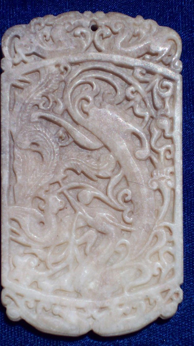 YUAN / MING CHINESE CARVED NEPHRITE JADE TABLET: Exceptional Chinese carved nephrite jade tablet. Superior carving of a dragon with phoenix forms . Probably Yuan or Ming Dynasty . Height 3/12". Provenance: Private Collection