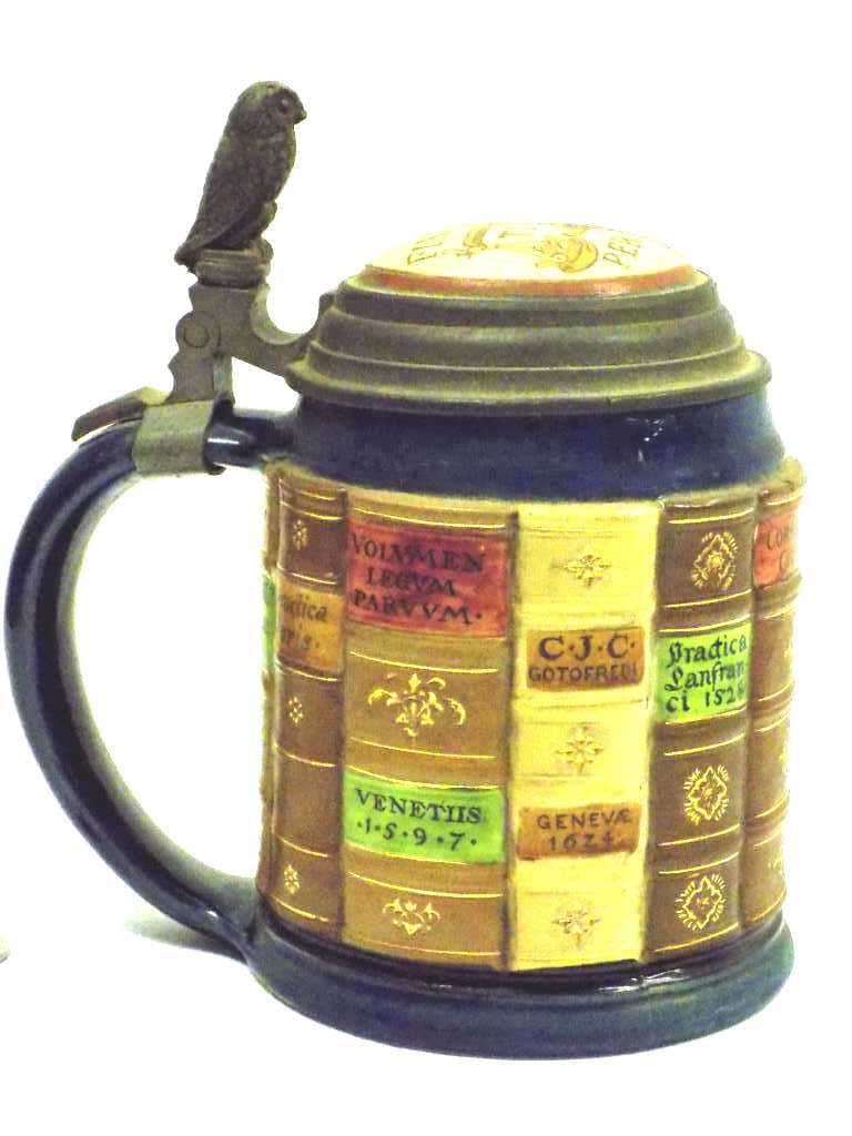 METTLACH STEIN No 2001 BOOK SPINES MATHEMATICIANS: Mettlach Pottery Beer Stein No. 2001. Entitled Book Spines For Mathematicians. Surrounding Etched Gilt Leatherbound Math Books. Rare Scales of Justice Variant Lid. Pewter Owl Finial. Design Attributed