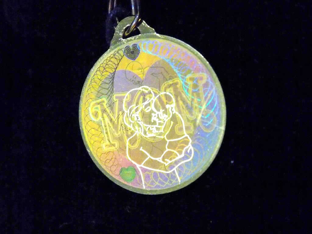 24K GOLD MICHAEL ANTHONY MOM NECKLACE PENDANT: Pure 24K Yellow Gold Michael Anthony Mom Necklace Pendant. Alternating Laser Graphics Depicting Mom in a Heart and a Mother holding a Baby. New with Box & Papers.