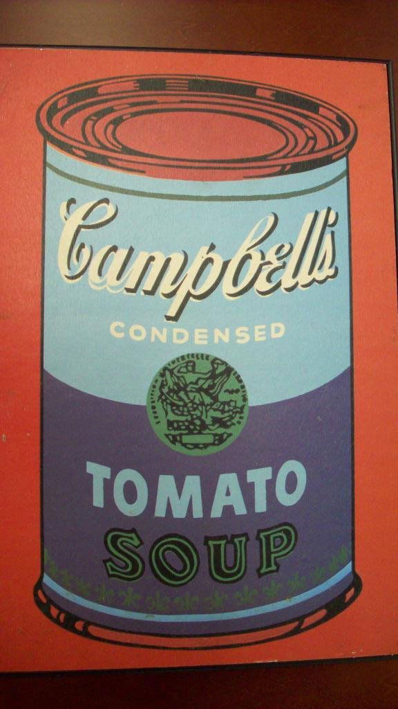 ANDY WARHOL CAMPBELL SOUP CAN LITHOGRAPH: Andy Warhol 1928-1987 American. World famous vintage Campbell's / Campbell Soup can color lithograph. H 12" x L 8" . Framed professionally in Modern silver frame.
