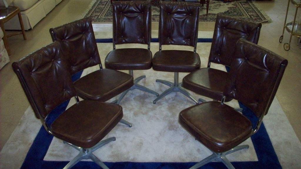6 MIDCENTURY MODERN CHROMCRAFT CHAIRS: Midcentury Modern CHROMCRAFT tufted brown vinyl & chrome rolling swivel chairs . H 34" x Seat 15.50". Signed base labels. We do not ship furniture.